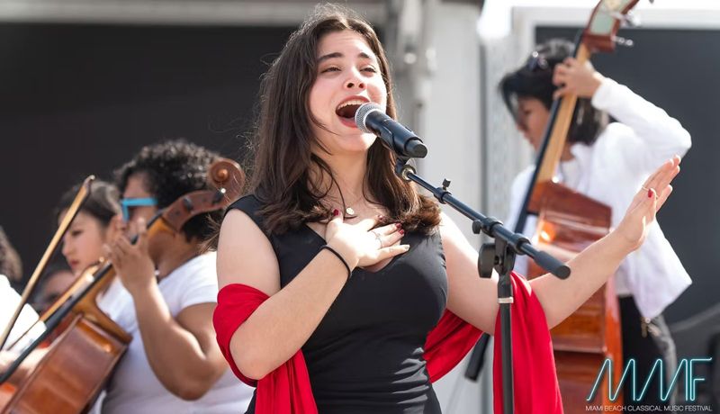 Frankie singing with orchestra at the Miami Music Festival Spring Concert